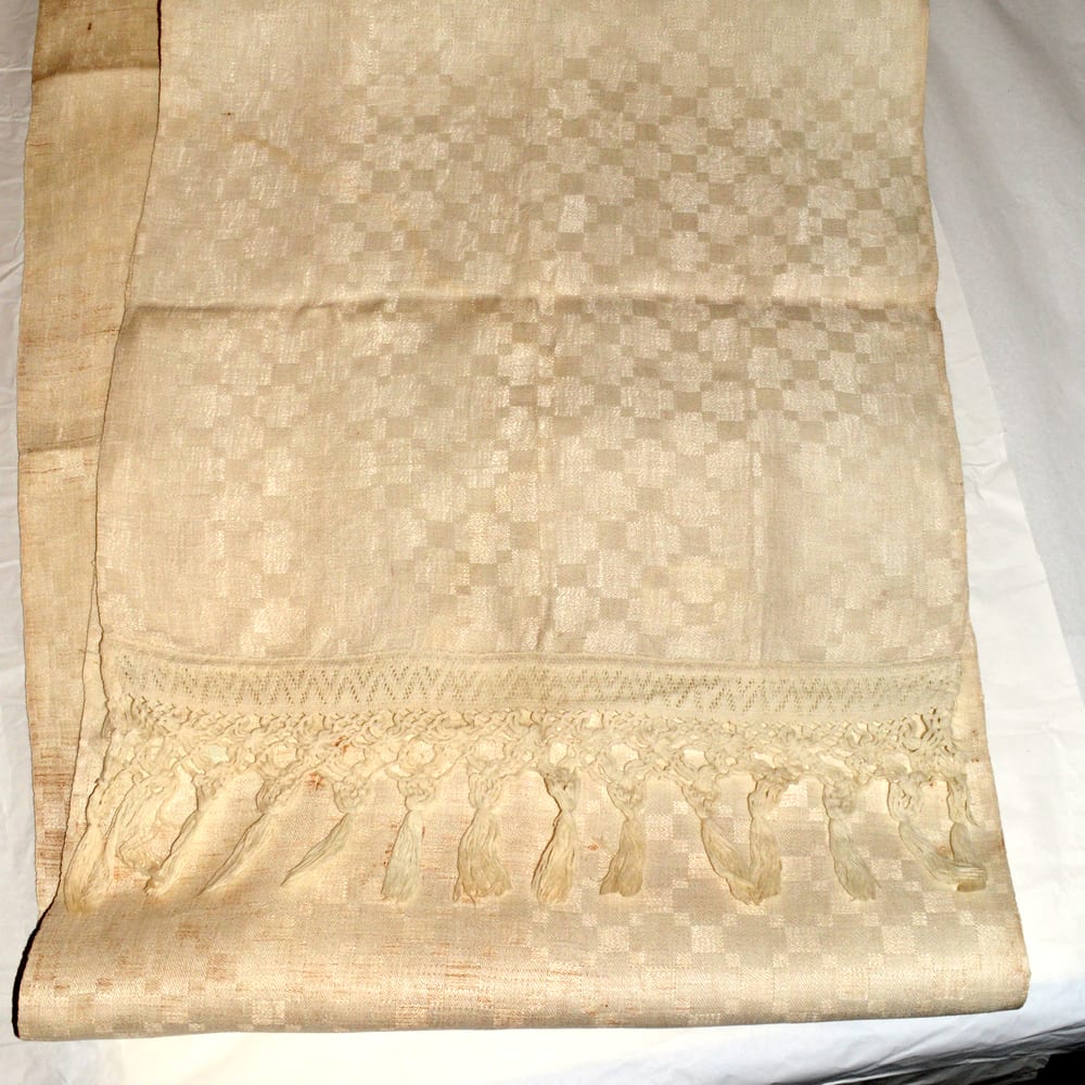 A hand-woven cotton towel, folded