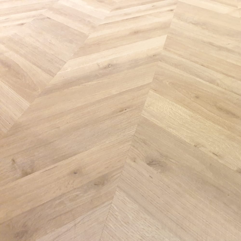 Pale chevron parquet flooring